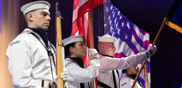 Naval Capital Region’s Ceremonial Guard parades the colors during the opening ceremony the Sea Air Space Exposition 2021.  Petty Officer 3rd Class Kyleigh Williams