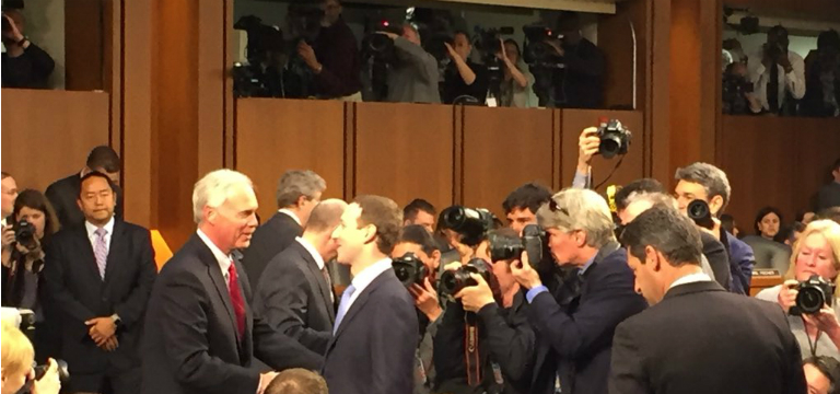 Facebook founder and CEO Mark Zuckerberg greets Sen. Ron Johnson (R-Wisc.) in a Senate hearing room. Photo credit: Chase Gunter/FCW