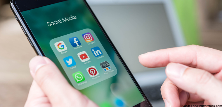 social media tools on phone (Vasin Lee/Shutterstock.com)