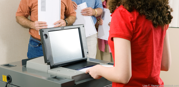 scanning a ballot (Lisa F. Young/Shutterstock.com)