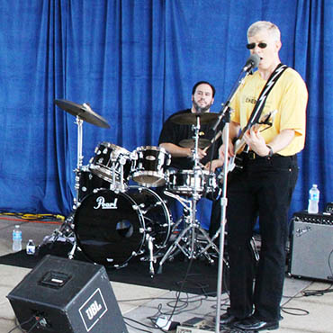 National Nuclear Security Administration (Flickr): Deputy Secretary of Energy Daniel Poneman leads his band, “Yellow Cake,” at “Lollachilipalooza”