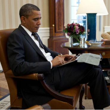 President Barack Obama receives the Presidential Daily Briefing from Robert Cardillo, Deputy Director of National Intelligence for Intelligence Integration, in the Oval Office, Jan. 31, 2012. Part of the briefing was done using a tablet computer. (Official White House Photo by Pete Souza)