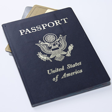 Shutterstock image: United States passport with an unidentifiable credit card resting underneath it.