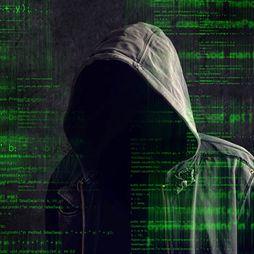 Shutterstock image (by igor.stevanovic): anonymous computer hacker.