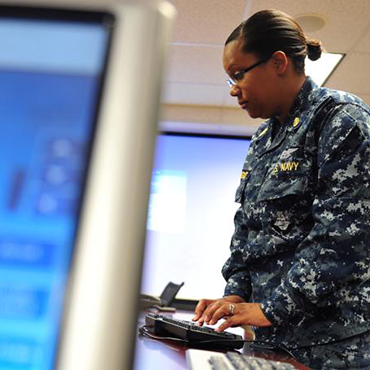 Navy person using keyboard