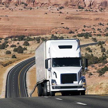 Shutterstock image (by Henryk Sadura): Semi truck on a highway in Utah.