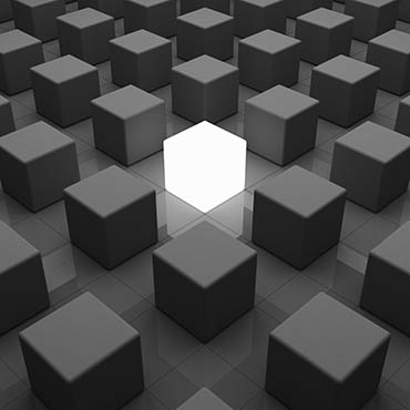 Shutterstock image: a single luminous box among similar grey, ordered boxes.