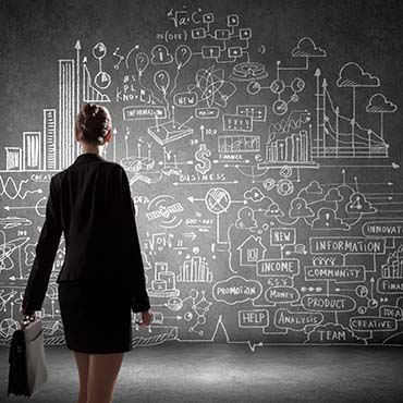 Shutterstock image: businesswoman looking at a career plan.
