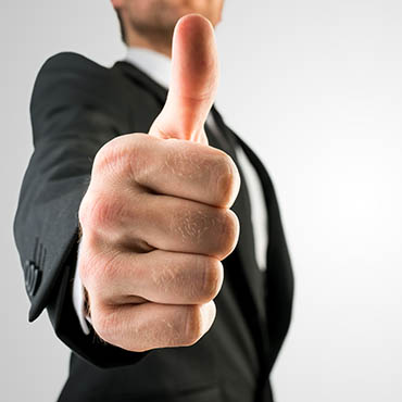 Shutterstock image (by Gajus): businessman giving a thumbs up.