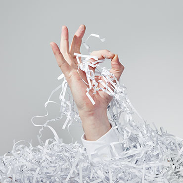 Shutterstock image (by Tim Masters): okay sign emerging from a pile of shredded papers.