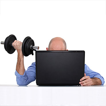 Shutterstock image: lifting weights in front of a computer.