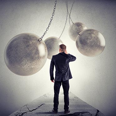 Shutterstock image (by alphaspirit): Difficulties ahead for the businessman.